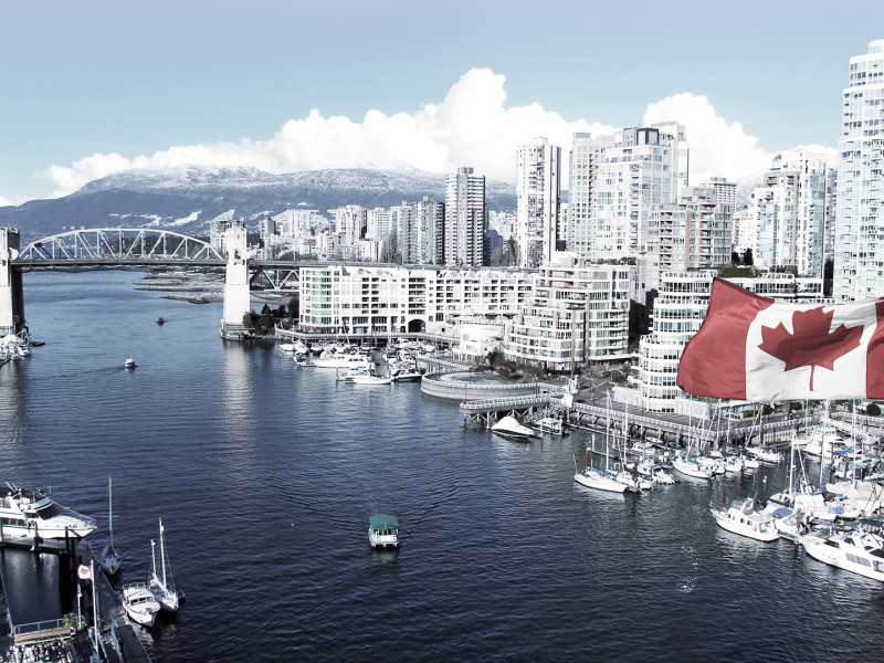 Canadian flag in front of Vancouver