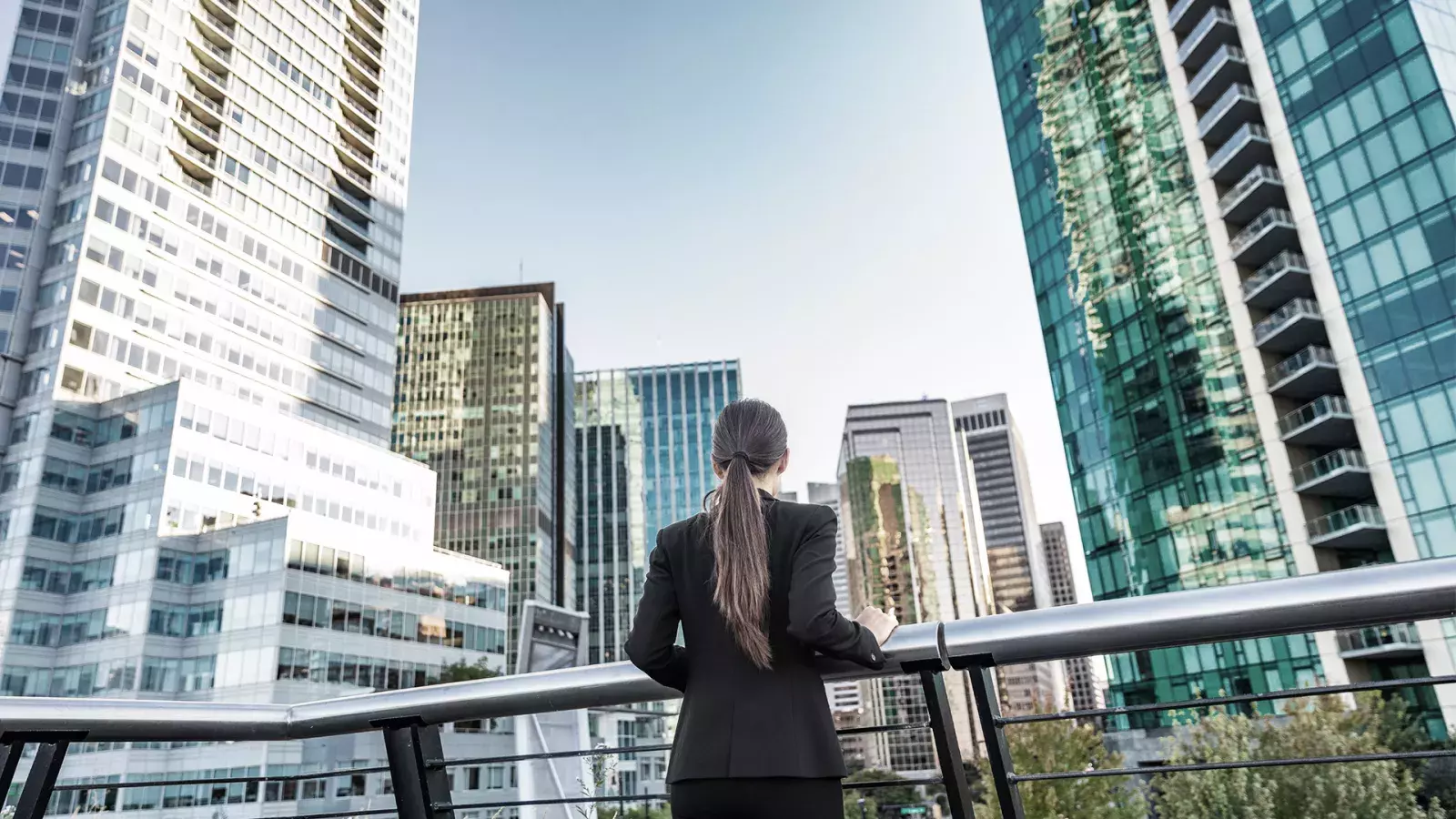 Woman looking up at skyline